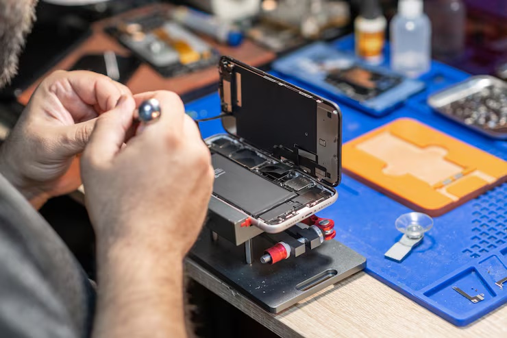 Battery replacement on an Apple device at the repair bench